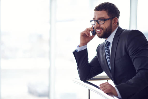 istock Modern businessman speaking on mobile phone 1151848905