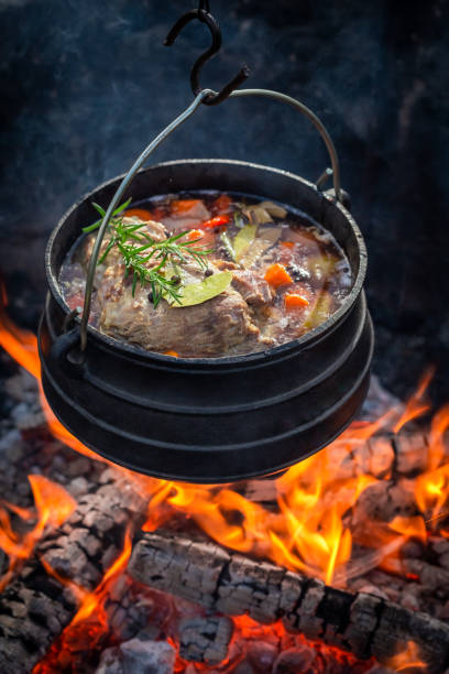istock Delicious and fresh hunter's stew with vegetables on bonfire 1151848956
