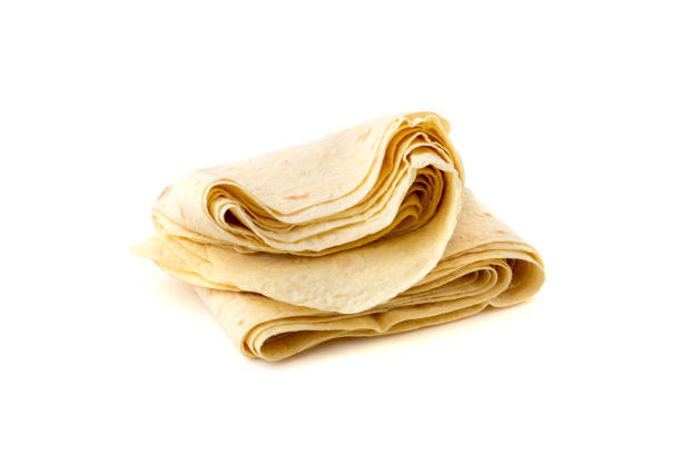 istock Thin pita bread on a white background. Armenian pita bread close-up. 1151850358
