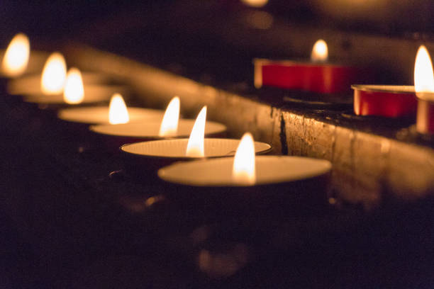 istock The view of lighted tealight candles. Burning candles. 1151851553