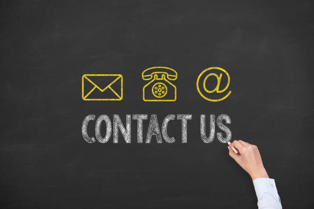 istock Human Hand Drawing Contact Us on Blackboard 1151851844