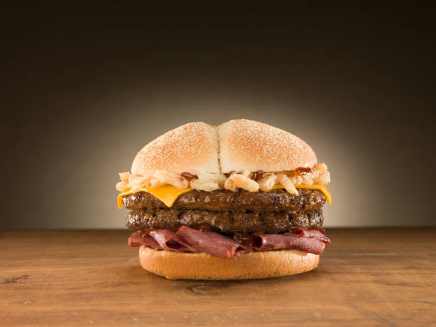 istock Double Cheese burger on wooden table. 1151852275