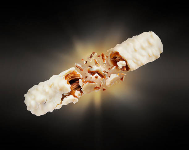 istock Milk chocolate bar with nuts crushed in the dark 1151852446