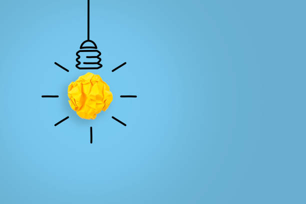 istock New Idea Concepts Light Bulb Crumpled Paper on Blue Background 1151853088