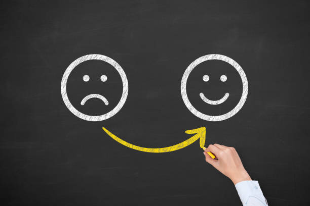 istock Hand Drawing Unhappy and Happy on Blackboard 1151853367
