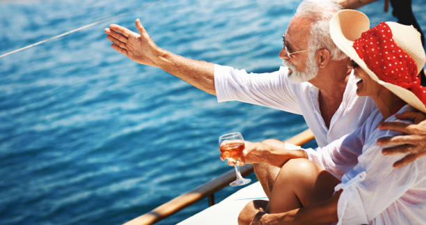 istock Senior couple on a sailing cruise. 1151856384