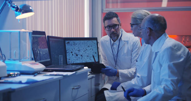 Scientists watching monitor and analyzing