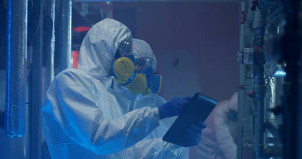 istock Scientists in hazmat suit conducting maintenance 1151860987