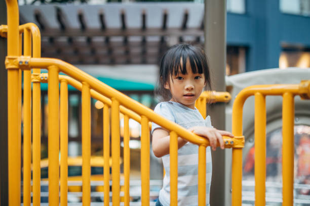 istock Girl playing in park 1151861616