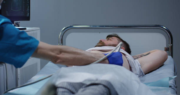 istock Doctor examining man with ultrasound 1151861763