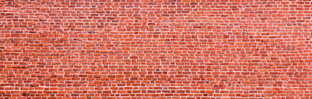 istock Brick wall, wide panorama of masonry. Wall with small Bricks 1151862218
