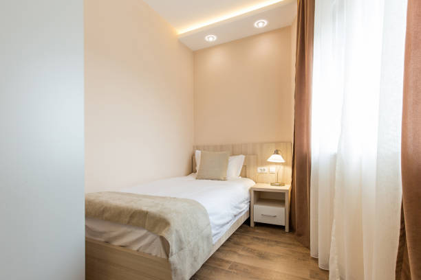 istock Hotel room interior,double bed beige bedroom 1151863348