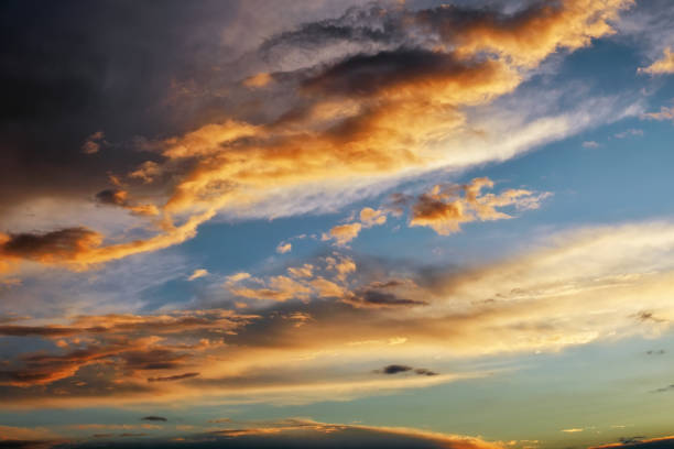 istock Beautiful dark fluffy cloudy sky. Sunset light. 1151863367