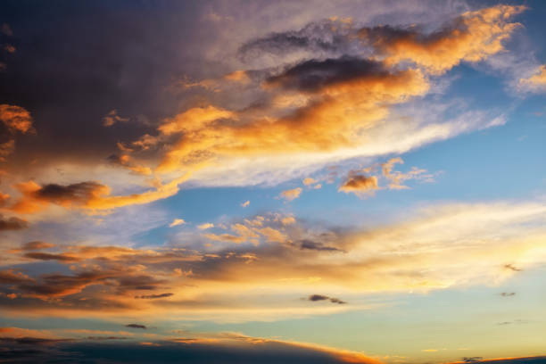 istock Beautiful dark fluffy cloudy sky. Sunset light. 1151863380