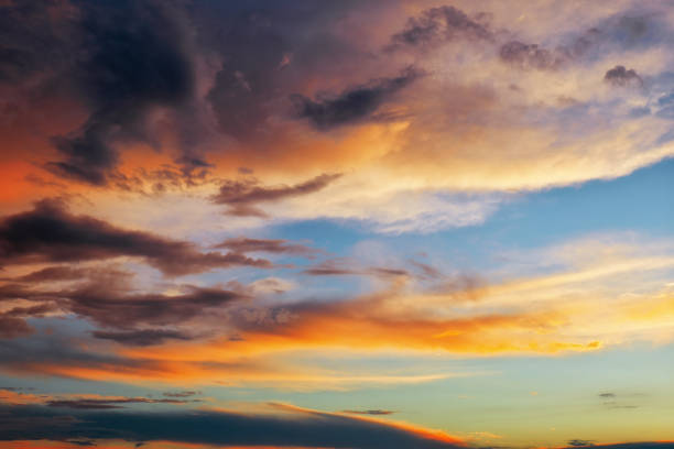 istock Beautiful dark fluffy cloudy sky. Sunset light. 1151863417