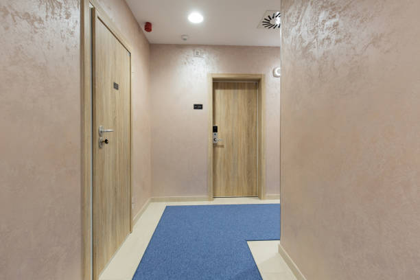 istock Hotel corridor with apartment doors 1151863445