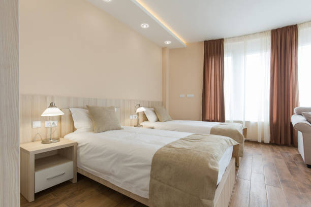 istock Hotel room interior,double bed beige bedroom 1151863703