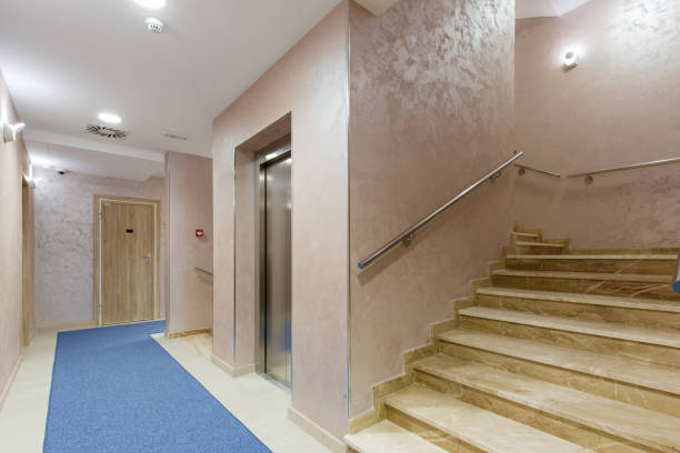istock Hotel corridor with apartment doors and stairs 1151864617
