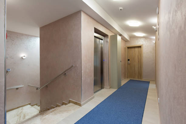 istock Hotel corridor with apartment doors and stairs 1151864698