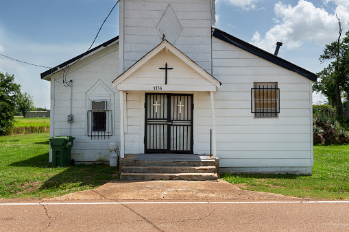 Tunica, Mississippi, USA - June 23, 2014: The facade of an old baptist church at the Cobb Road near Tunica, Mississippi