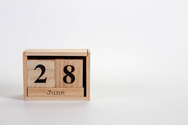 istock Wooden calendar June 28 on a white background 1151866626