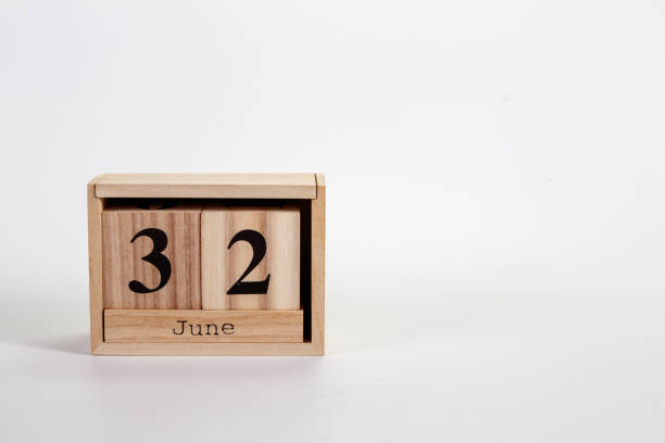 istock Wooden calendar June 32 on a white background 1151866634