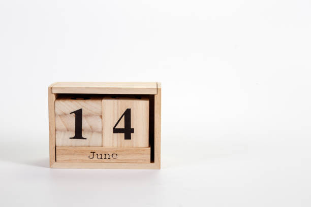 istock Wooden calendar June 14 on a white background 1151866647