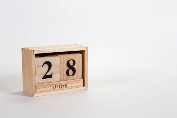 istock Wooden calendar June 28 on a white background 1151866746