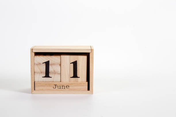 istock Wooden calendar June 11 on a white background 1151866793