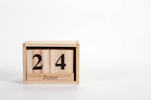 istock Wooden calendar June 24 on a white background 1151866892