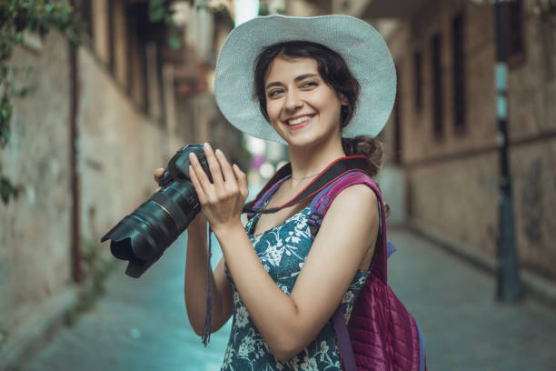 istock happy woman photographer 1151866940