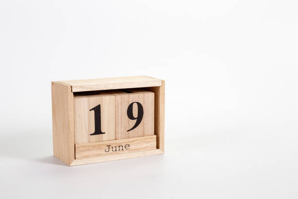 istock Wooden calendar June 19 on a white background 1151866944