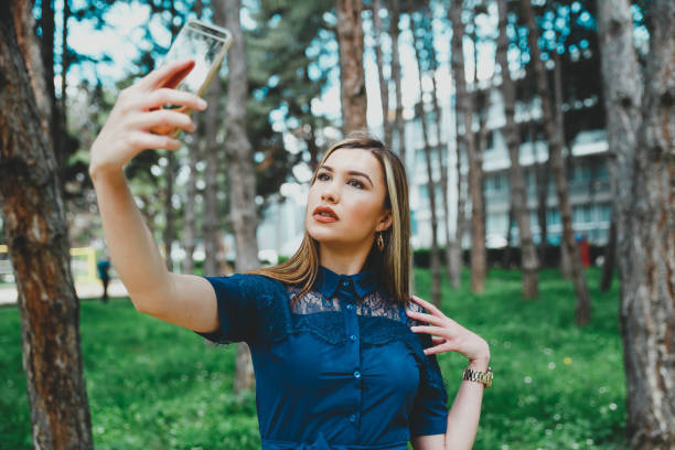 istock Elegant woman taking selfie 1151867606
