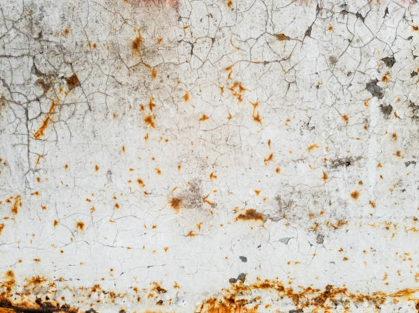 istock Texture of white paint with cracks and rust on metal surface, background. 1151868174