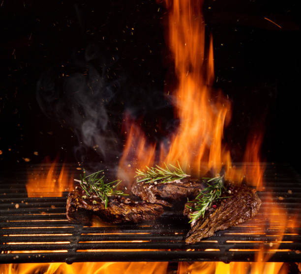 istock Beef steaks on the grill with flames 1151868251