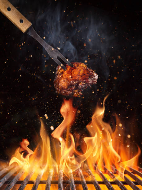 istock Chicken piece on the grill with flames 1151868929