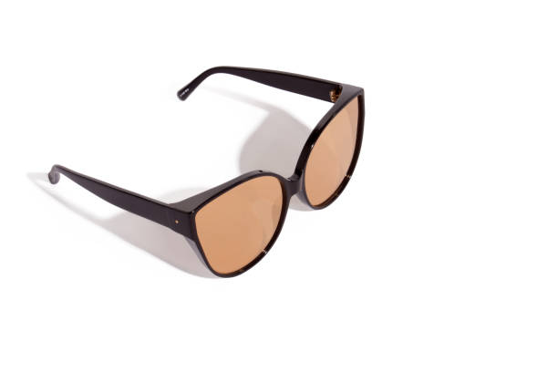 istock Trendy retro mirrored golden sunglasses in black plastic frame. 1151870940