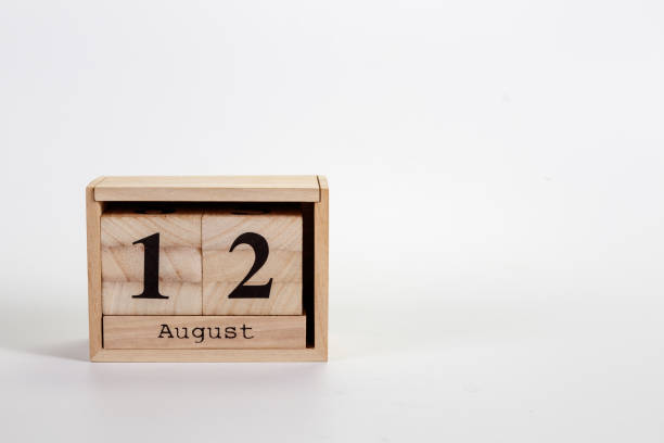 istock Wooden calendar August 12 on a white background 1151871184