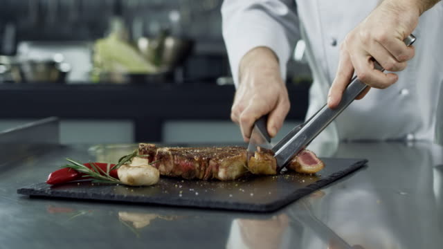 https://media.istockphoto.com/id/1151871302/video/chef-hands-cutting-grill-steak-at-kitchen-closeup-chef-hands-slicing-fried-meat.jpg?s=640x640&k=20&c=dRXKBRxLAJKEQYjNnRjF_8n278cXAeicKZEfvGqYiBA=