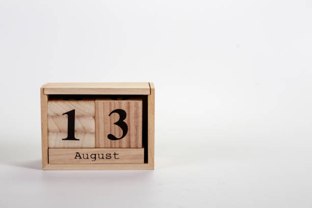 istock Wooden calendar August 13 on a white background 1151871343