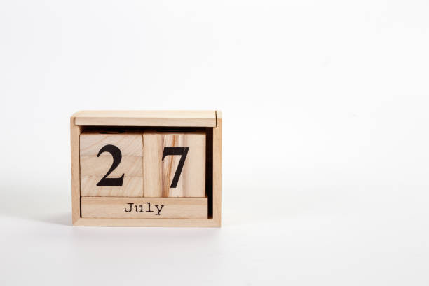 istock Wooden calendar July 27 on a white background 1151872003