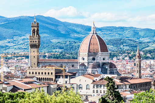 Picturesque view of beautiful Florence and the Apennines. The dome of the Cathedral of Santa Maria della Grazia and the Palazzo Vecchio tower