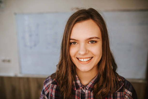istock Young girl smiling in school 1151879069
