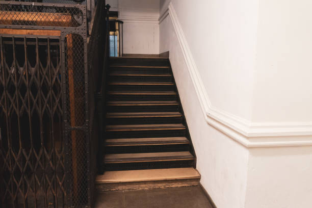 istock Vintage staircase and white wall 1151881253
