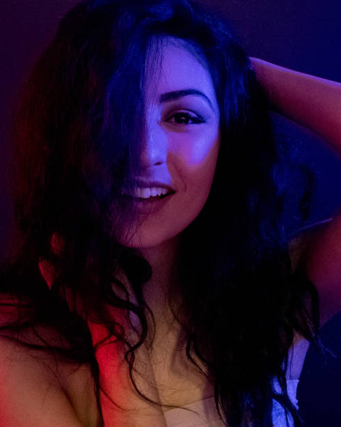 istock Attractive female in blue and red light 1151886131