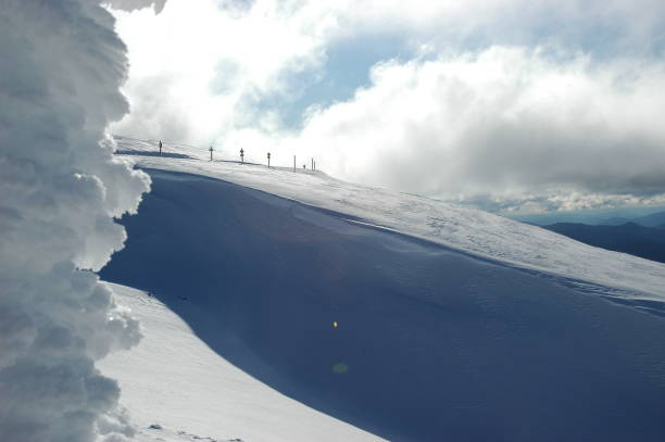 istock Road signs on a snow-covered mountain. 1151887270