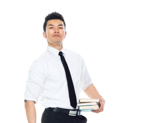 istock Handsome Asian Businessman - is holding books 1151887683