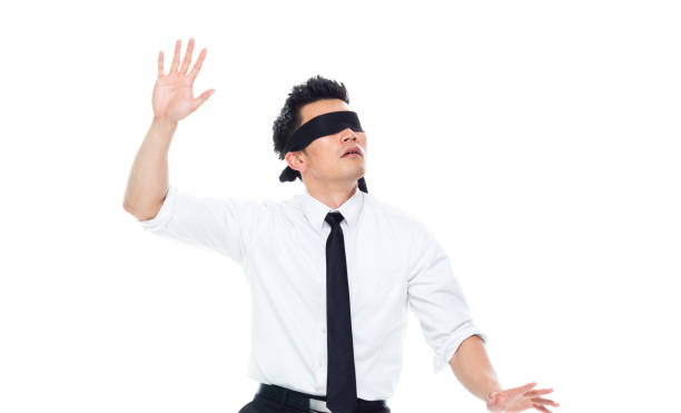 istock Handsome Asian Businessman - is wearing a blindfold 1151887685