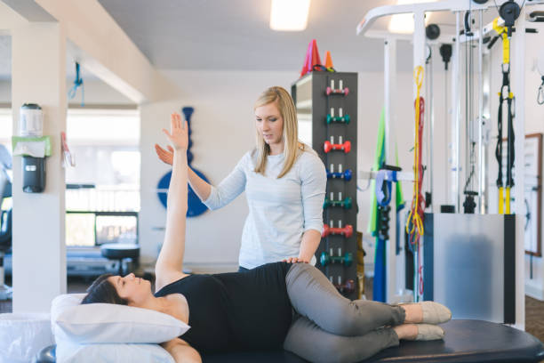 istock Pregnant woman doing physical therapy 1151887730