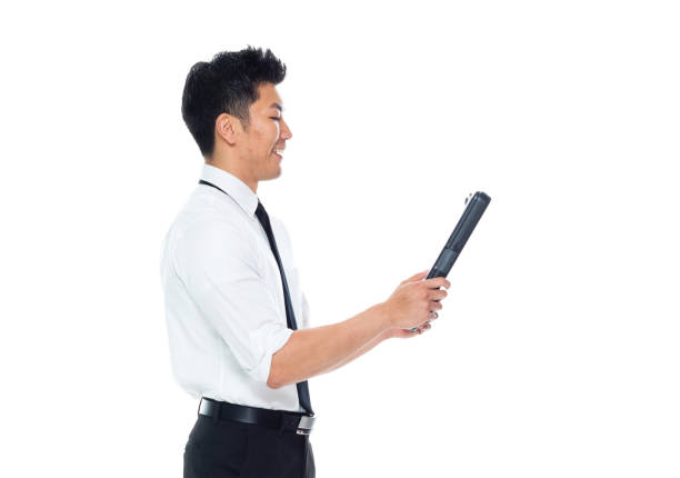 istock Handsome Asian Businessman - using a clipboard 1151887891